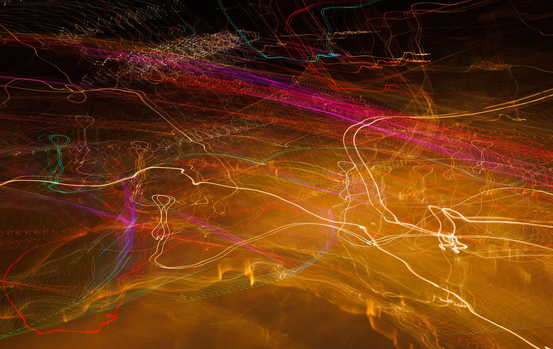 Vibrant long exposure photo capturing colorful light streaks in motion.